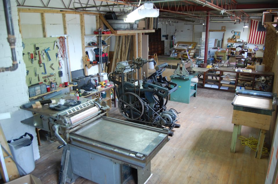 Printing presses in an open room. Dinderbeck Studios.