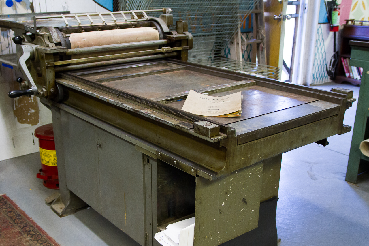 A large, mechanical printing press